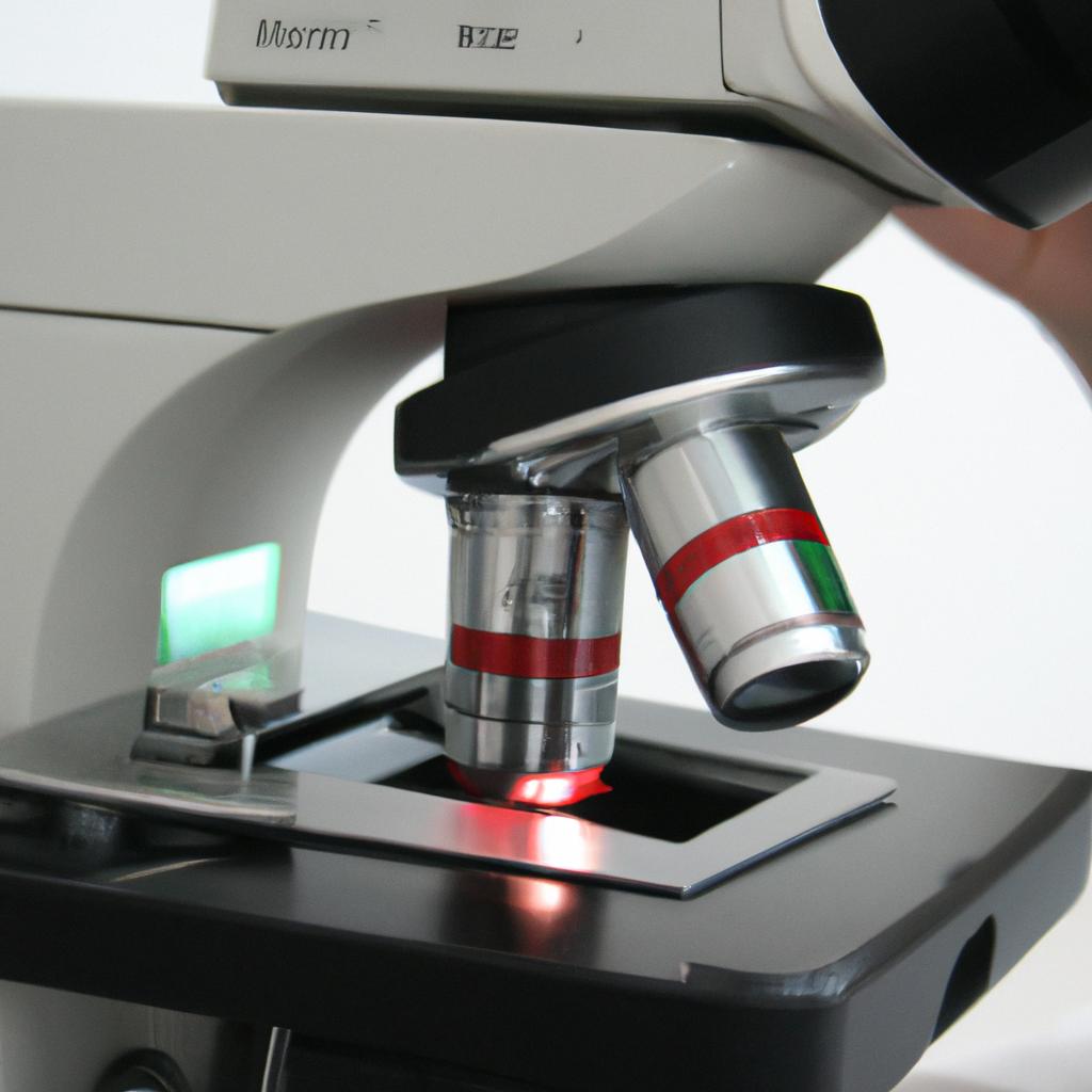Person holding microscope, analyzing blood
